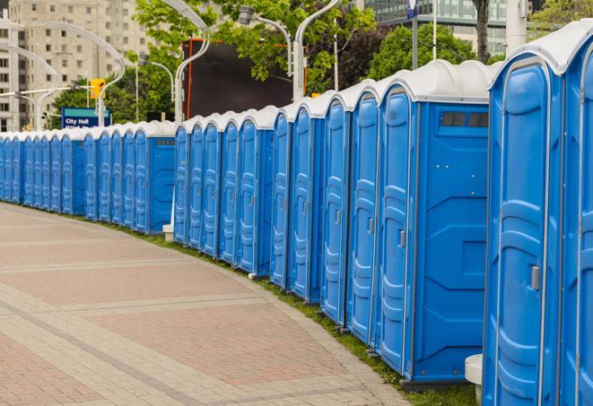 portable restrooms lined up at a marathon, ensuring runners can take a much-needed bathroom break in Bedford